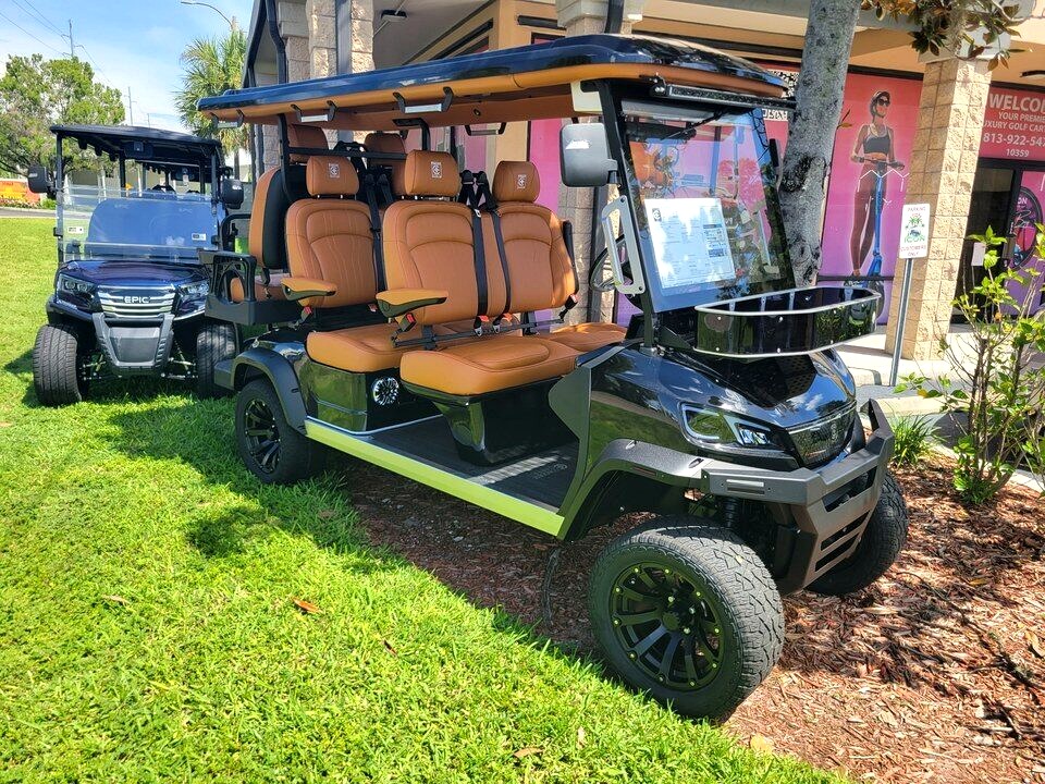 Black Conquest S60L golf cart with tan leather seats