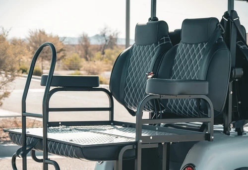 Rear-facing view of EPIC E40L with diamond-stitched seating and flip-down rear platform