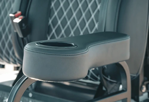 Close-up of EPIC E40L armrest cup holder and rear passenger grab bar