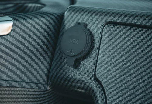 Close-up of 12V accessory power port on EPIC E40L dashboard