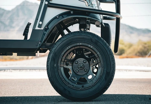 Rear wheel view of EPIC E40L with lifted frame and all-terrain clearance