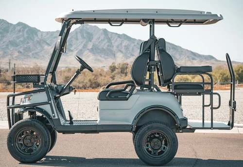 Side profile of EPIC E40L 4-passenger lifted cart with premium wheels and accessories