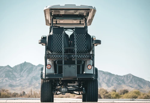 Rear view of EPIC E40L lifted golf cart with storage basket and tail light detail