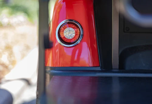 Rear taillight and body panel of EPIC E60 in bright red with textured trim