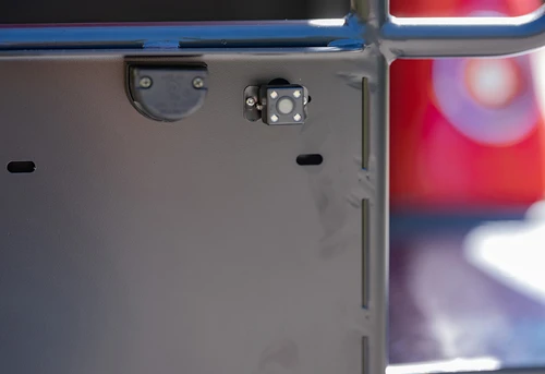 Rear-mounted camera and integrated license plate light on EPIC E60 cargo rail