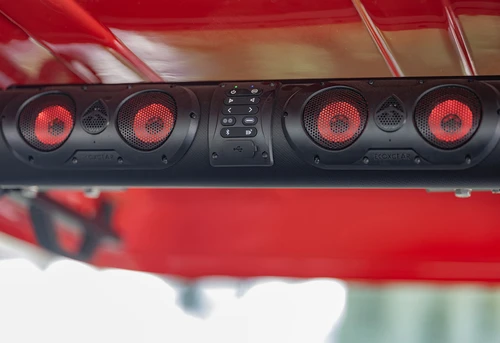 Under-roof view of EPIC E60 sound system with 28-inch EcoXGear Bluetooth soundbar and four red speakers