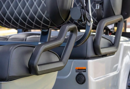 Side profile of EPIC E60L showing foldable armrest and 3-point safety seatbelt system