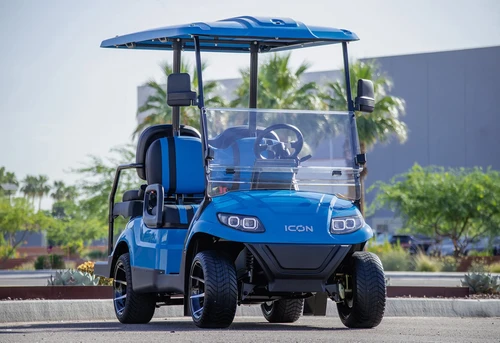 Front view of blue 2025 ICON i40 golf cart with tinted windshield and LED headlights
