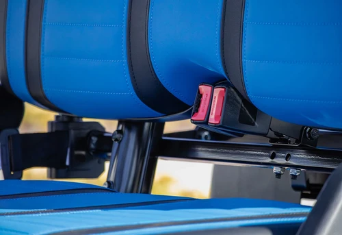 Marine-grade vinyl seats with black and blue two-tone design on ICON i40 golf cart