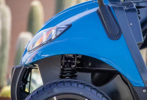 LED headlight assembly on blue ICON i40 golf cart – close-up of lighting detail