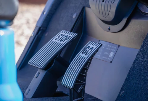 Aluminum STOP and GO pedal controls on 2025 ICON i40 golf cart – footwell close-up