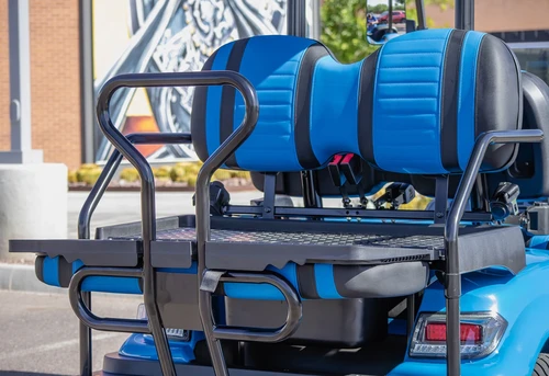 Rear seat with flip-down functionality and safety bars on ICON i40 electric cart