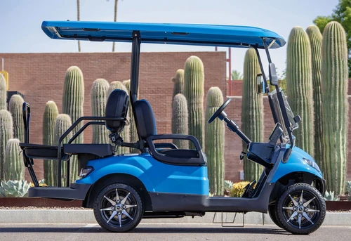 Side profile of blue 2025 ICON i40 with lifted chassis and full-length roof