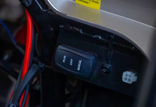 Power toggle and system wires mounted near ICON i60 dashboard