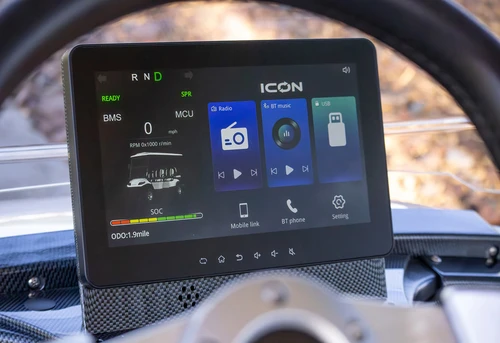 10.1-inch digital display on ICON i60L dash showing Bluetooth, radio, diagnostics, and media options