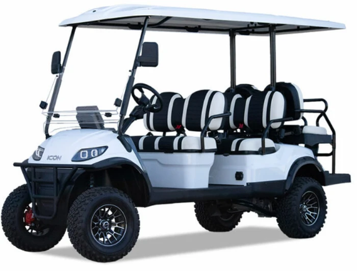 2025 ICON i60L lifted 6-passenger golf cart in white with black and white deluxe seats, all-terrain tires, and extended roof — front angle view